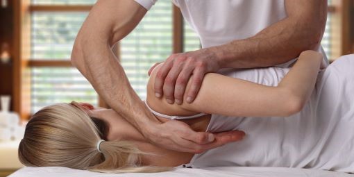 A woman receives physiotherapy care.