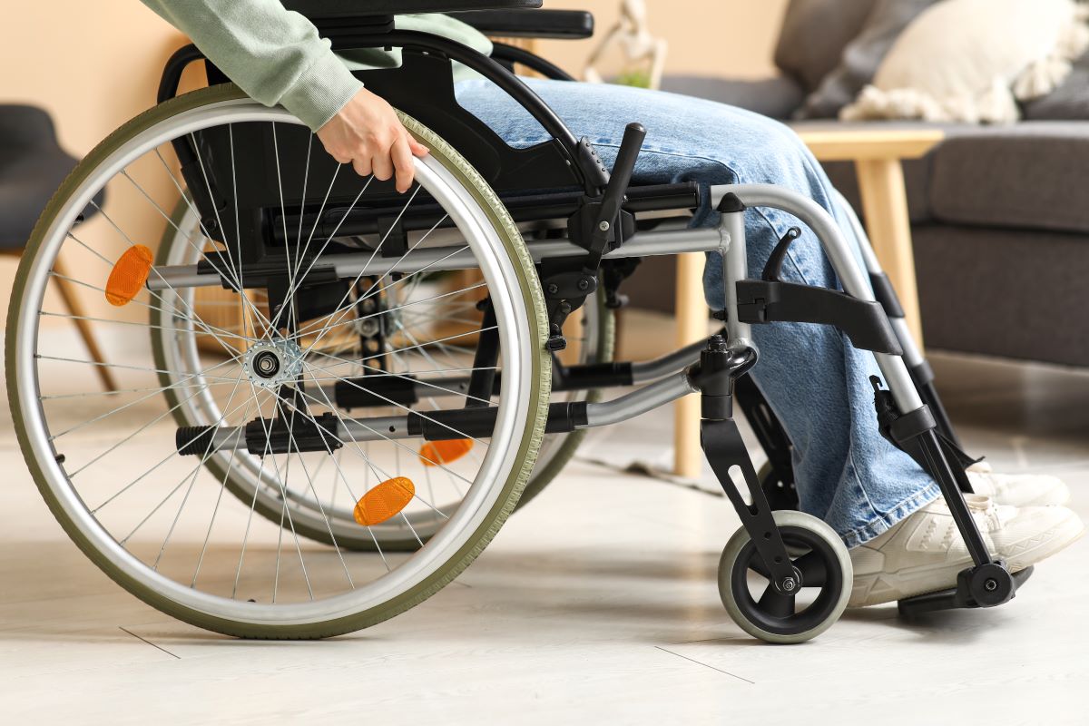 Someone sits in a wheelchair.